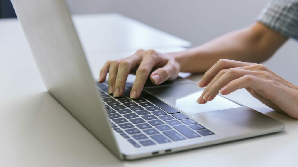 Woman hand using laptop or computor searching for information in internet online society web. Search